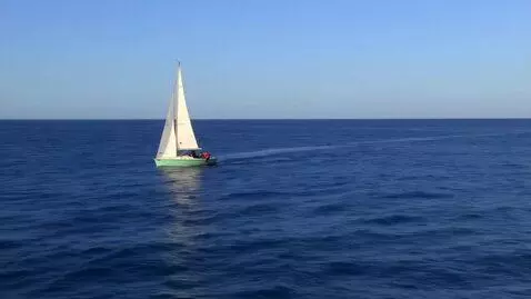AI Video from prompt: it's a very sunny day  in the middle of the ocea