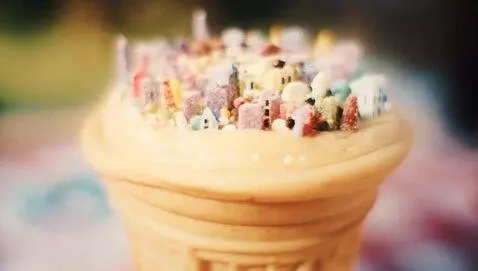 AI Video from prompt: a tiny city on top of vanilla ice cream cone