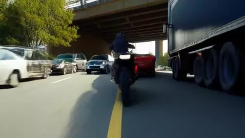 AI Video from prompt: A car is being chased by 2 motorcycles in broad 