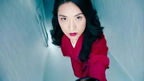 AI Video from prompt: Mulan from Mulan as a real person, looking at th