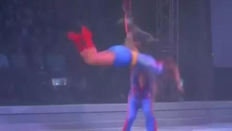 AI Video from prompt: POV of trapeze artist performing aerial tricks b