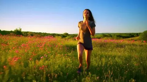 a girl with big boobs running