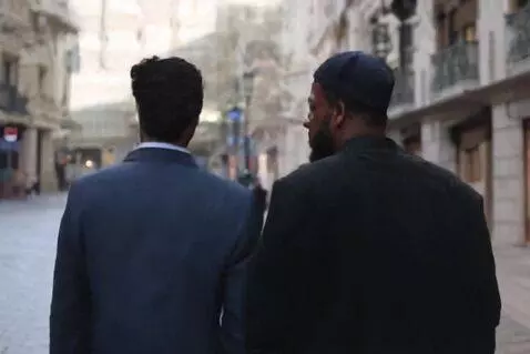 AI Video from prompt: Two mens walking in a city