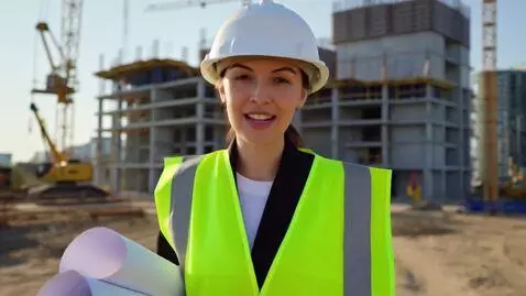 AI Video from prompt: A confident female civil engineer in a white har