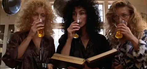 AI Video from prompt: The women take a drink from their cups, then sla
