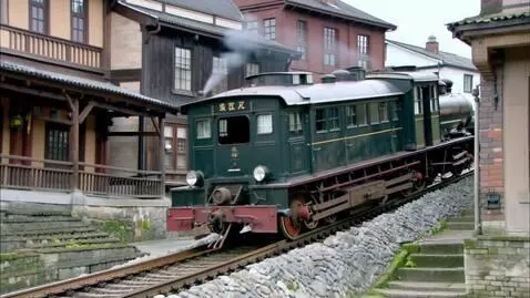 AI Video from prompt: Поезд с инициалами Мистер Фёдор, едет верх по зд