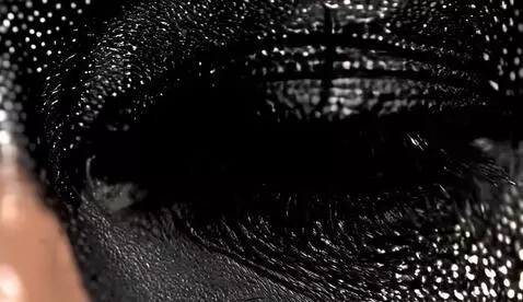 AI Video from prompt: dragon eye, skin black, eye orange like fire