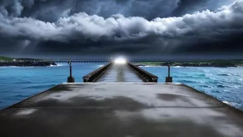 AI Video from prompt: A translucent white raincoat lies still at the e