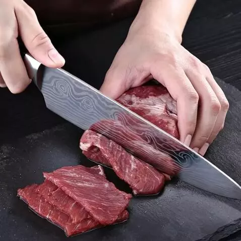 AI Video from prompt: a man cuts meat with a knife