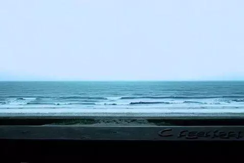 AI Video from prompt: A distant panoramic vista of the sea under a clo
