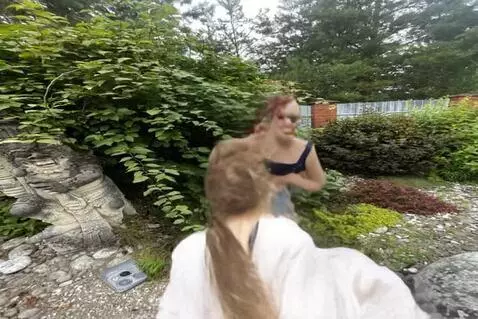 AI Video from prompt: Пусть девушка с фотографии бежит по лесу, а за н