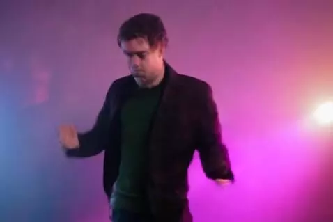 AI Video from prompt: European man dancing in club and then jumps into