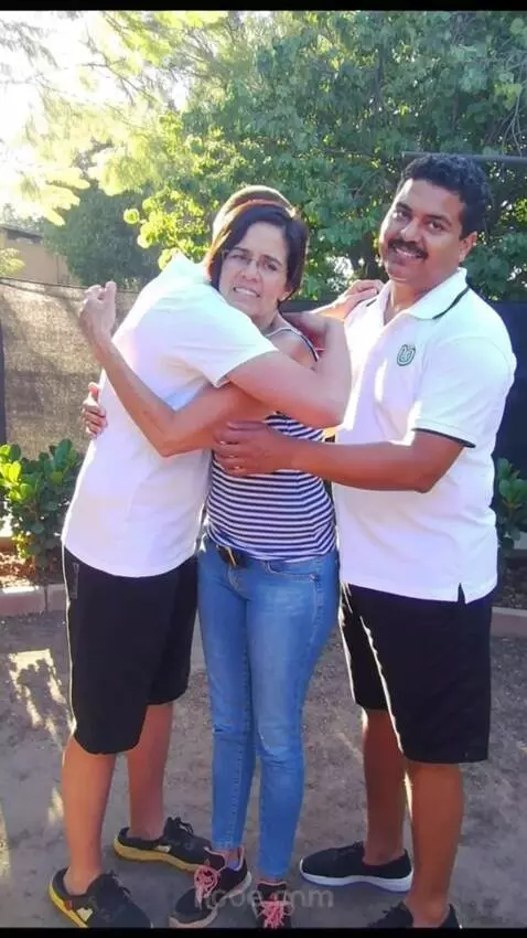 AI Video from prompt: The woman hugs the man with the darker skin and 