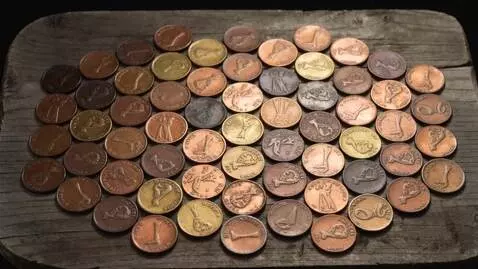AI Video from prompt: Make a red-themed background out of old coins