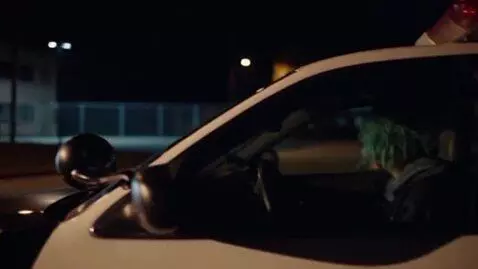 AI Video from prompt: It's dark evening. The streetlights are on. Cora