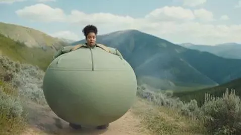 AI Video from prompt: a woman on a hike. suddenly POOF and her body be