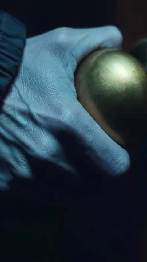 AI Video from prompt: Cinematic 9:16 close-up. Same hand, same cadaver