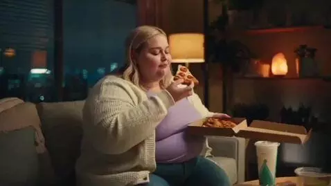 AI Video from prompt: White blonde Female getting fatter by eating fas