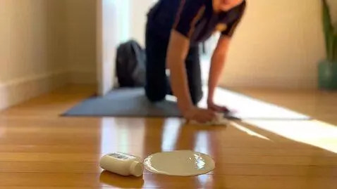 AI Video from prompt: Make this person clean up lotion  off the floor 