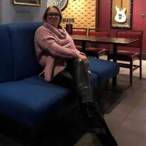 AI Video from prompt: a sitting sixty-year-old woman in the image of a