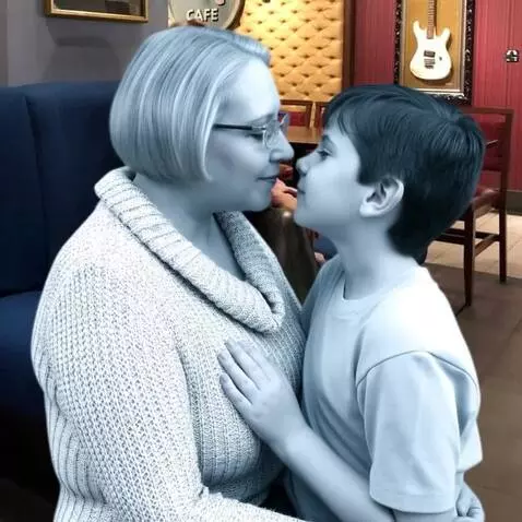 AI Video from prompt: a sitting sixty-year-old woman in the image of a