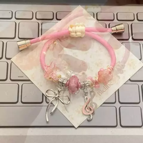 AI Video from prompt: Aesthetic product video of a handmade pink beade