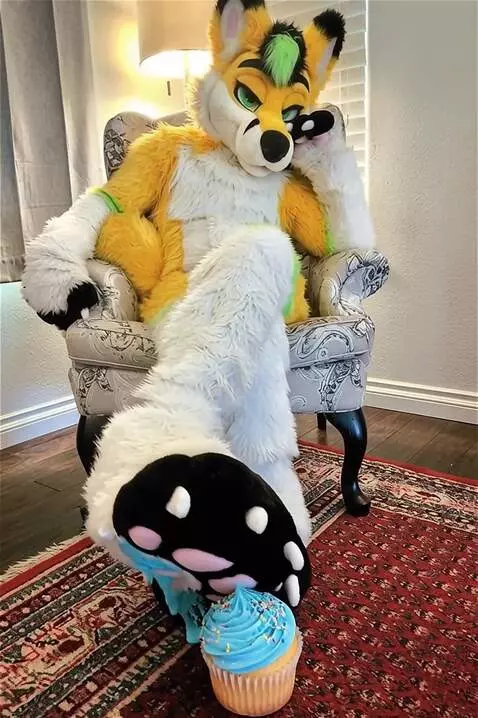 AI Video from prompt: Anthrofurry fursuit sitting down in hotel room o