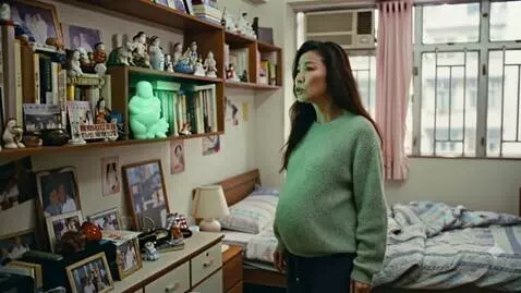 AI Video from prompt: A very full Chinese woman is standing in her apa