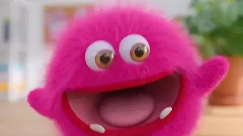 AI Video from prompt: Real-life Meebas pink monster saying SUPRISE in 