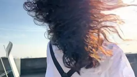 AI Video from prompt: The girl is singing and moving to techno music, 