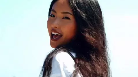 AI Video from prompt: The girl is singing and moving to techno music, 