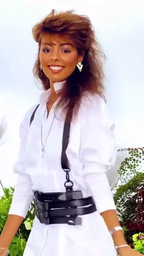 AI Video from prompt: A girl in a dress is dancing and spinning around