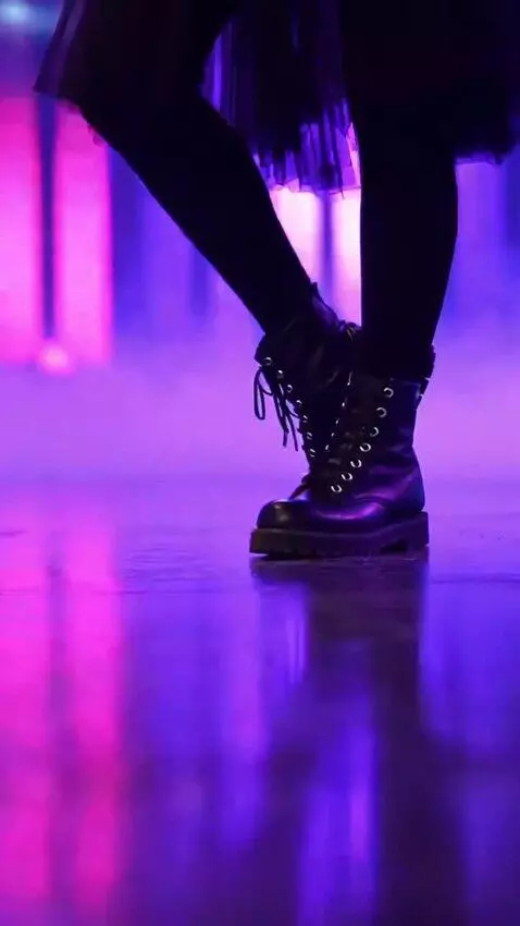 AI Video from prompt: A girl sings in a tutu skirt, rests her feet, do