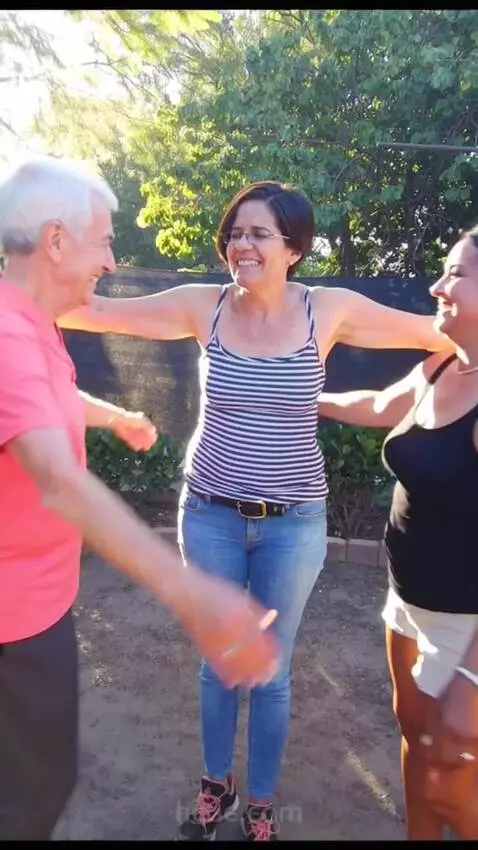 AI Video from prompt: An 60 year old man and a woman hugs the woman