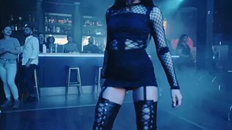 AI Video from prompt: A laced up Gothic latino girl At a dance club