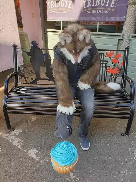 AI Video from prompt: Fursuit costume sitting leaning back looking dow