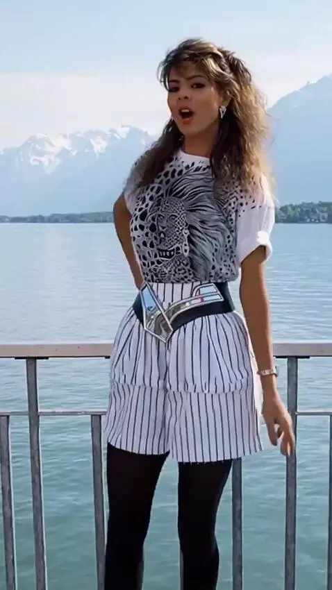 AI Video from prompt: A woman in a short skirt is singing, turning aro