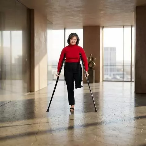 AI Video from prompt: A one-legged woman walks with a steady, measured