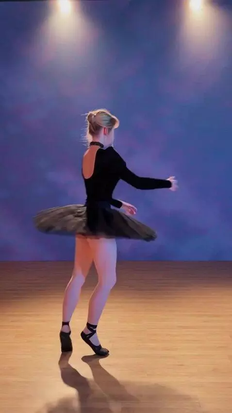AI Video from prompt: The girl in the tutu skirt turns around and does