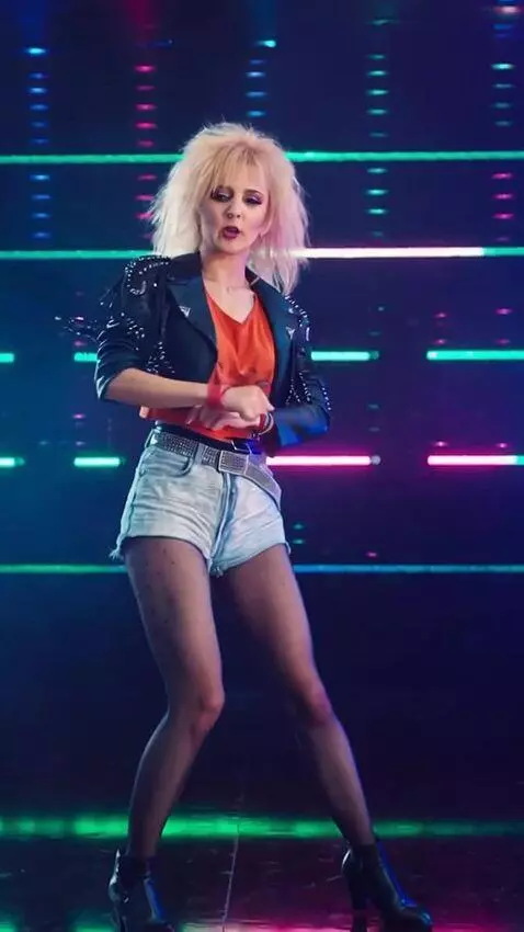 AI Video from prompt: The girl is singing and dancing to techno music,