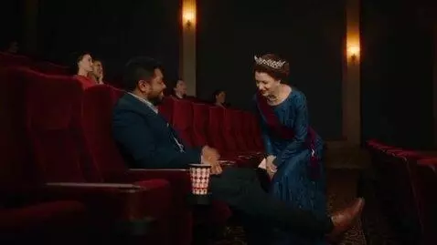 AI Video from prompt: In the cinema, the queen stepped on a man's face