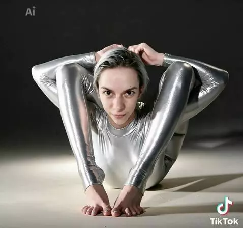 AI Video from prompt: Fidget toes and fingers while breathing and blin