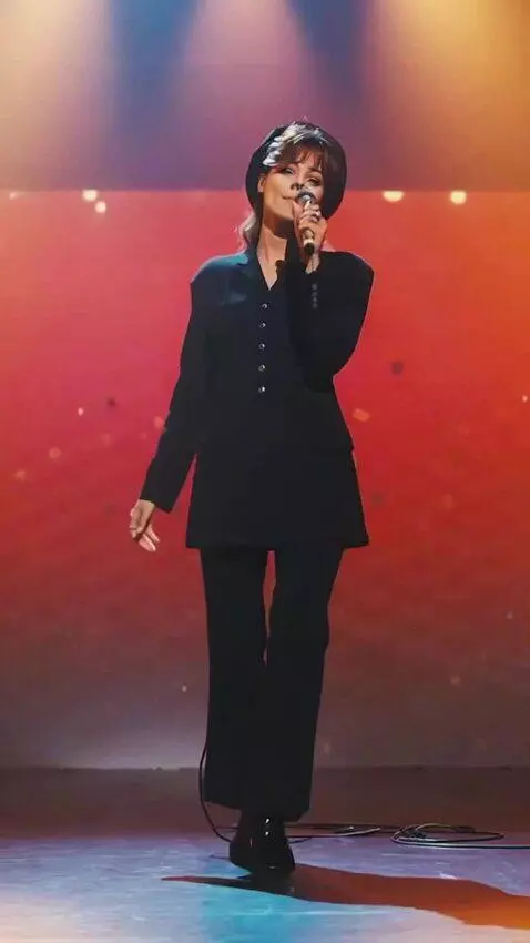 AI Video from prompt: The girl is singing and doing a pirouette, and h