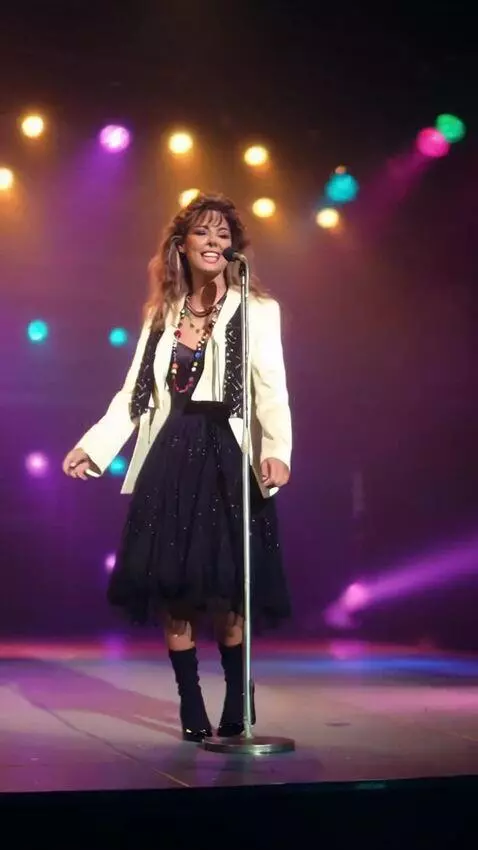 AI Video from prompt: A girl in a skirt is singing a song, and doing a