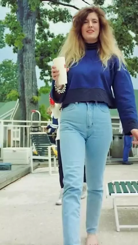 AI Video from prompt: smiling young blond woman barefoot with slightly