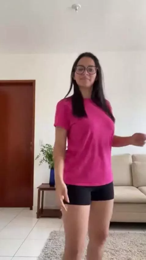 AI Video from prompt: A skinny brazilian girl, 18 yo, pink t-shirt tha