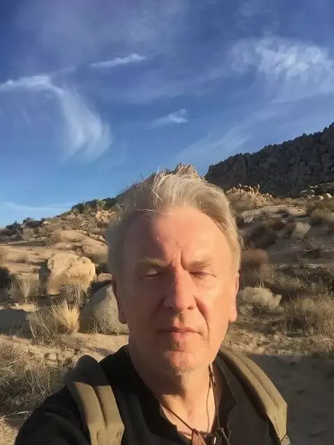 AI Video from prompt: the shows introducer is in a hiking environment 