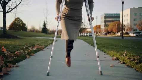 AI Video from prompt: A one-legged woman walks with a steady, measured