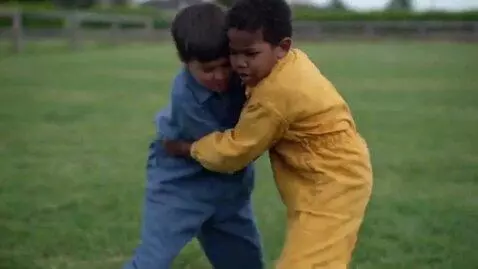 AI Video from prompt: two boys at four years,wearing  jumpsuits,barefo