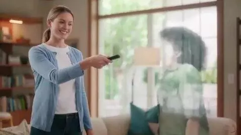 AI Video from prompt: A woman uses a remote to shrink another woman wh